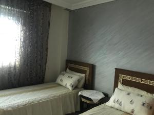 Letto o letti in una camera di Urban Oasis