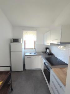 Kuchyňa alebo kuchynka v ubytovaní Apartments Norma