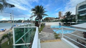 a resort with a swimming pool and a beach at Mar de Ponta Negra in Natal