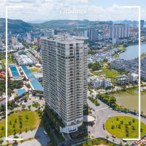 an aerial view of a city with a tall building at Sweet Home - Duplex 3BRS Citadines Hạ Long in Ha Long