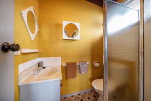 a bathroom with a sink and a toilet at Pebble Views by Property Mums in Flinders +24 photos