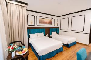 Postel nebo postele na pokoji v ubytování A&D Luxury Hotel