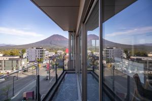 a view of a city from a building window at The Maples Niseko in Kutchan