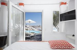 Postel nebo postele na pokoji v ubytování Alta Vista Suites