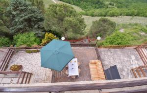 a blue umbrella sitting on top of a table at Gorgeous Home In Serrone With Wifi in Serrone