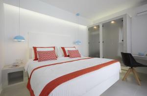 Postel nebo postele na pokoji v ubytování Alta Vista Suites