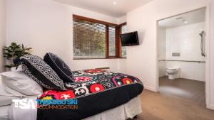 Ένα ή περισσότερα κρεβάτια σε δωμάτιο στο Elevation 5