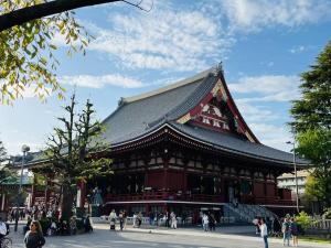 a building with a roof with people walking around it at 江元浅草 in Tokyo