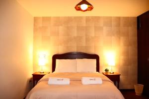 Ένα ή περισσότερα κρεβάτια σε δωμάτιο στο Hotel Sierra Alta Colca