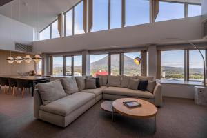 a living room with a couch and a table at The Maples Niseko in Kutchan