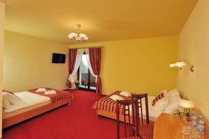 Postel nebo postele na pokoji v ubytování Hotel Na Błoniach