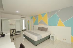 Krevet ili kreveti u jedinici u okviru objekta LPP Convention Hotel Demangan