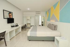 Krevet ili kreveti u jedinici u okviru objekta LPP Convention Hotel Demangan