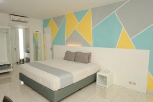 Krevet ili kreveti u jedinici u okviru objekta LPP Convention Hotel Demangan