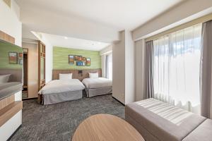 Postel nebo postele na pokoji v ubytování Hotel JAL City Nagano + 37 fotografií
