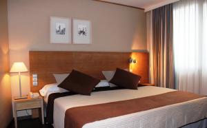 Postel nebo postele na pokoji v ubytování Eurohotel Castellón