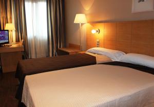 Postel nebo postele na pokoji v ubytování Eurohotel Castellón