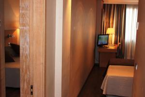 TV a/nebo společenská místnost v ubytování Eurohotel Castellón