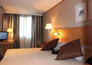 Postel nebo postele na pokoji v ubytování Eurohotel Castellón