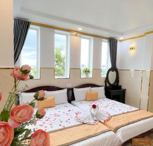 Postel nebo postele na pokoji v ubytování Gia An Hotel-Cần thơ