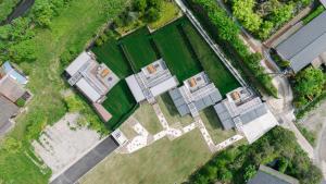 an overhead view of a house with a yard at グランステイ湯布院 GranStay YUFUIN in Yufu