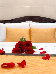 Postel nebo postele na pokoji v ubytování Gia An Hotel-Cần thơ