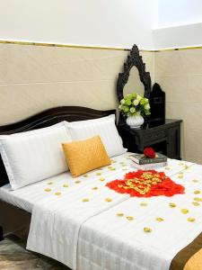 Postel nebo postele na pokoji v ubytování Gia An Hotel-Cần thơ