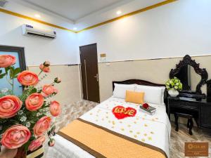 Postel nebo postele na pokoji v ubytování Gia An Hotel-Cần thơ