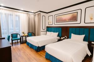 Postel nebo postele na pokoji v ubytování A&D Luxury Hotel