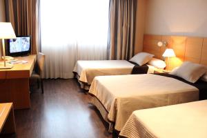 Postel nebo postele na pokoji v ubytování Eurohotel Castellón
