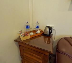 a table with two bottles of water on top of it at SurfBayVilla in Dickwella +47 photos