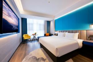 Letto o letti in una camera di Mehood Hotel Hanzhong Central Plaza