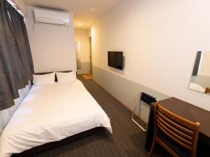 Postel nebo postele na pokoji v ubytování Hotel Taiyo Noen Tokushima Kenchomae + 37 fotografií