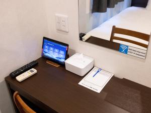TV a/nebo společenská místnost v ubytování Hotel Taiyo Noen Tokushima Kenchomae