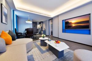 Area soggiorno di Mehood Hotel Hanzhong Central Plaza
