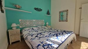 Ένα ή περισσότερα κρεβάτια σε δωμάτιο στο Dòmo a Palàttu casa vista mare a Porto Rotondo