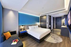 Letto o letti in una camera di Mehood Hotel Hanzhong Central Plaza