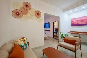 a living room with a couch and a table at Quinta Lolita - La Paz Baja California Sur in La Paz