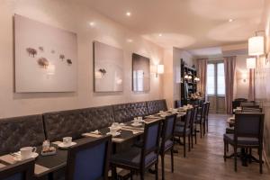 a row of tables and chairs in a restaurant at Magda Champs Elysées in Paris