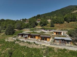 an aerial view of a house in a field at Ideal six-person villa for large families with pets, featuring barbecue and spacious yard Svaneti Сountryside 1 in Shkaleri
