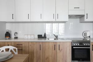 Kuchyňa alebo kuchynka v ubytovaní Luxury Apartment Zablocie WiFi Air Conditioning