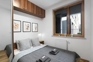 Posteľ alebo postele v izbe v ubytovaní Luxury Apartment Zablocie WiFi Air Conditioning