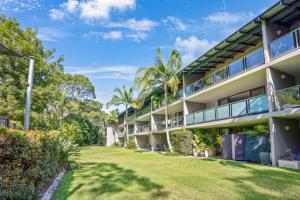 an exterior view of a building with a yard at Baden 58 - Rainbow Shores. Aircon. Wifi. Pools Walk to beach in Rainbow Beach