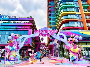 a group of hello kitty balloons in a city at The Lucky House in Thanh Hóa