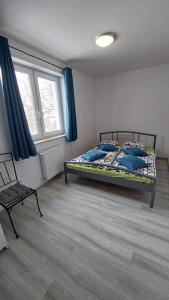 Ένα ή περισσότερα κρεβάτια σε δωμάτιο στο Słoneczne Wzgórze