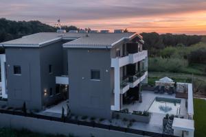 an aerial view of a house with a sunset at CHE BELLO NATURE in Preveza