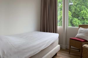 מיטה או מיטות בחדר ב-Hotel 't Spijker