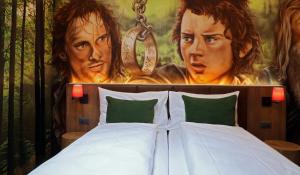 Postel nebo postele na pokoji v ubytování Hotel Cinema 8
