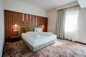 Voodi või voodid majutusasutuse Hotel Relax Craiova toas