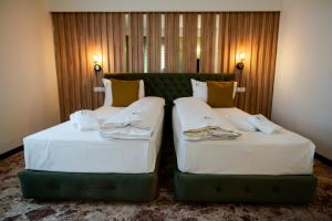Voodi või voodid majutusasutuse Hotel Relax Craiova toas